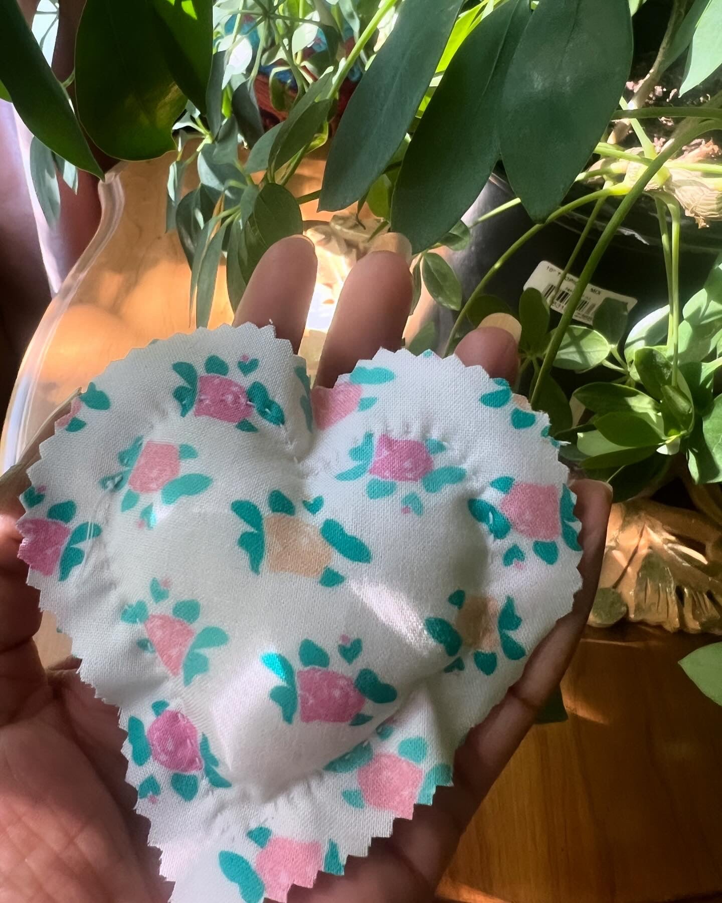 Eight handstitched soft hearts in assorted print fabric stuffed with poly fiber.