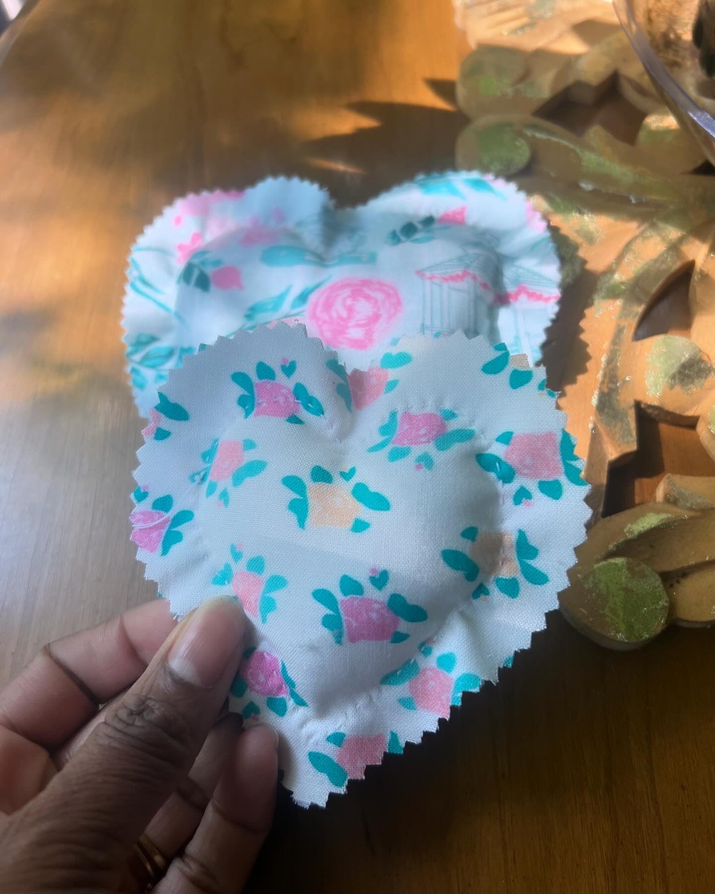 Eight handstitched soft hearts in assorted print fabric stuffed with poly fiber.