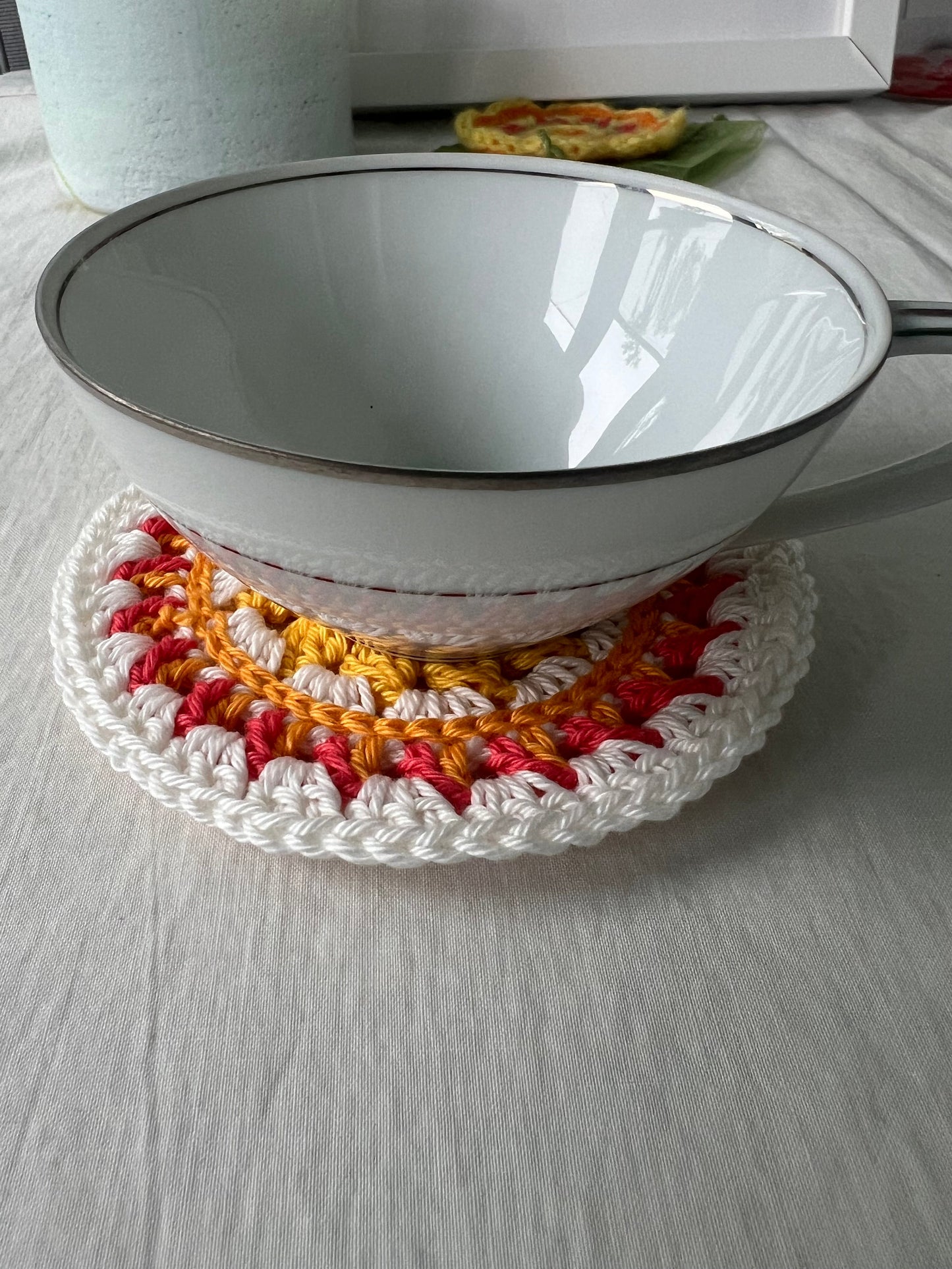 Crochet mini mandala art coasters in lemon, creme, strawberry, and mango. (Sold as 2-piece sets: you select 2 pieces. Specify the center color and petals. Pick 2 offering.)