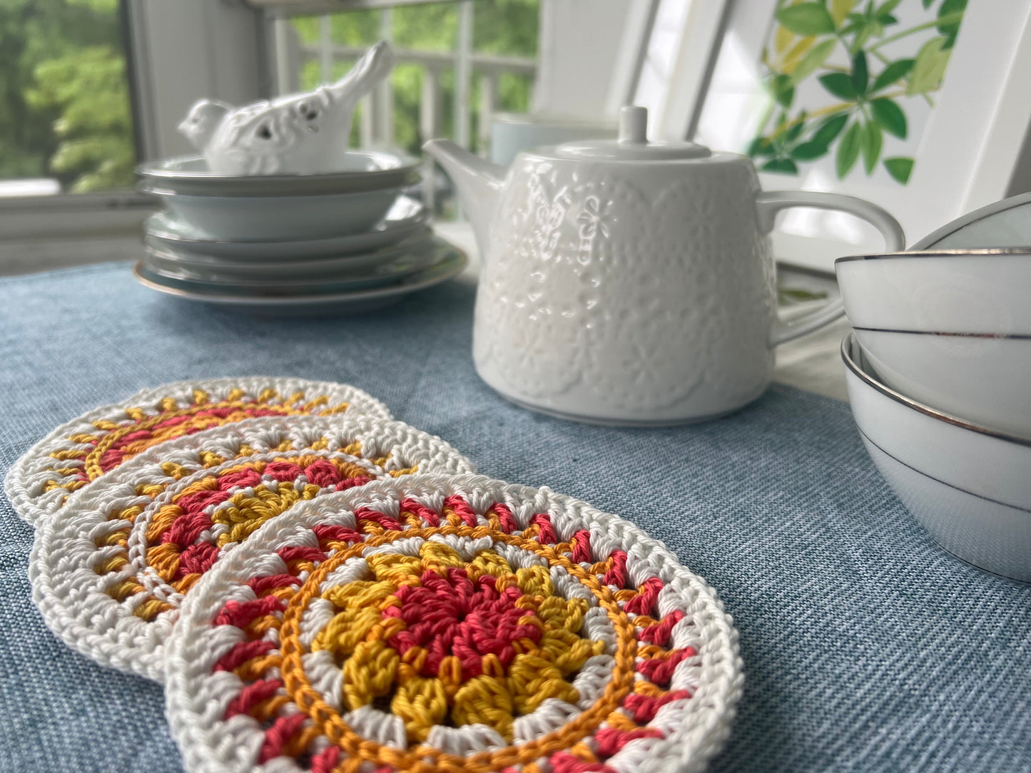 Crochet mini mandala art coasters in lemon, creme, strawberry, and mango. (Sold as 2-piece sets: you select 2 pieces. Specify the center color and petals. Pick 2 offering.)