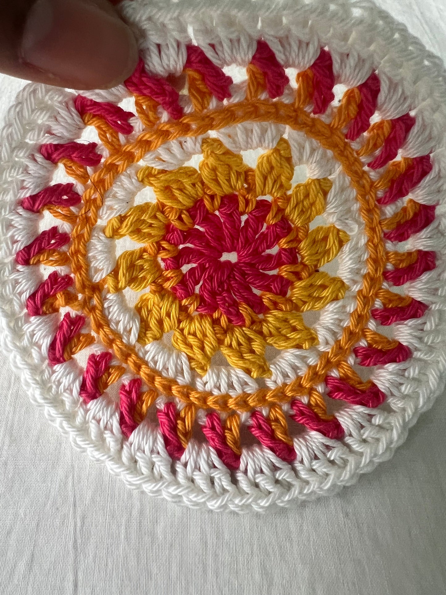 Crochet mini mandala art coasters in lemon, creme, strawberry, and mango. (Sold as 2-piece sets: you select 2 pieces. Specify the center color and petals. Pick 2 offering.)